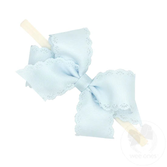 wee ones Small Vapor Blue Hair Bow with Embossed Eyelet Edge on White Nylon Band