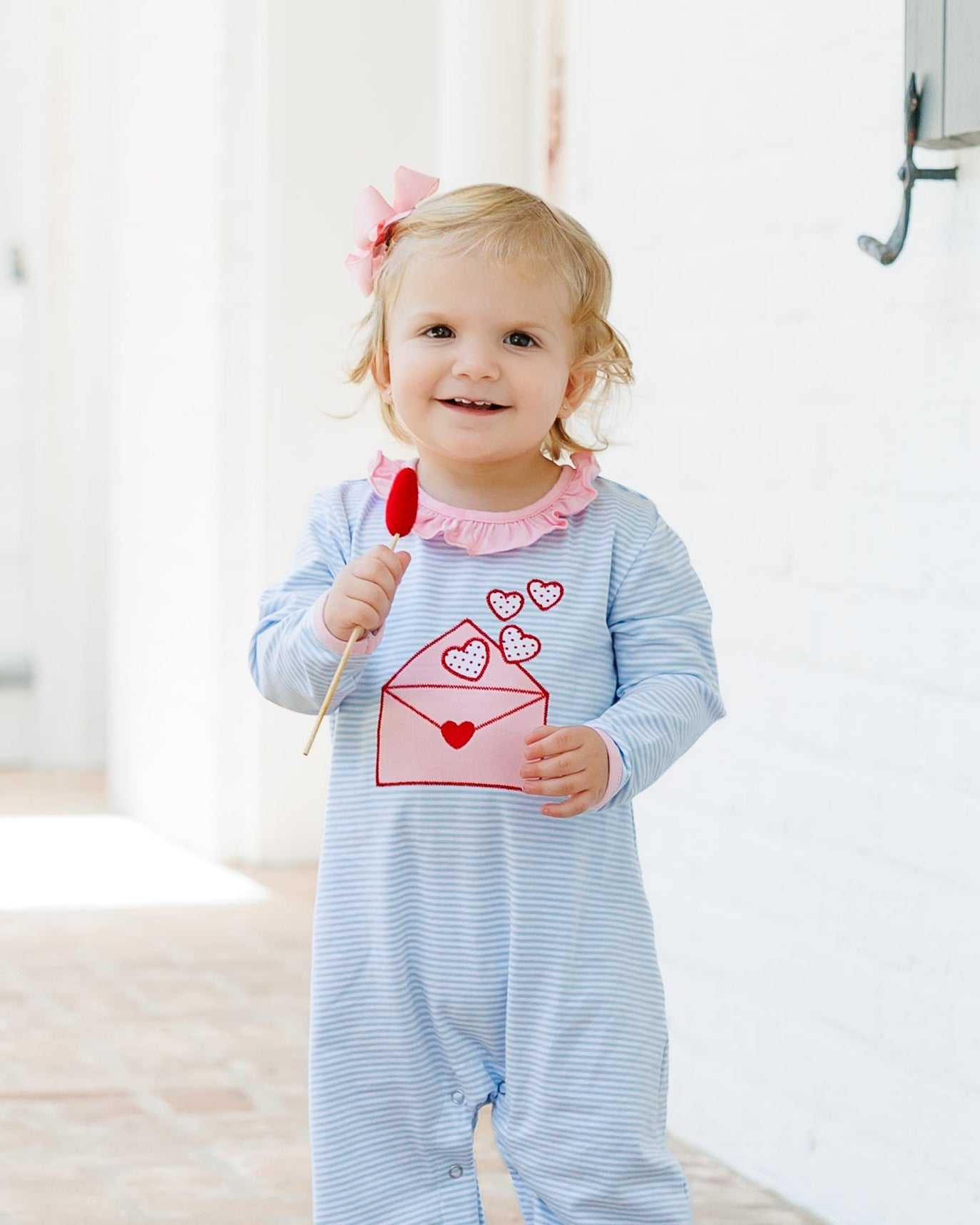 Jellybean Love Letters Ruffle Romper