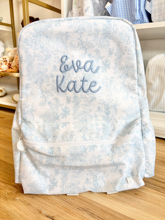 TRVL Blue Bunny Toile Backpack- Bubbly Font name