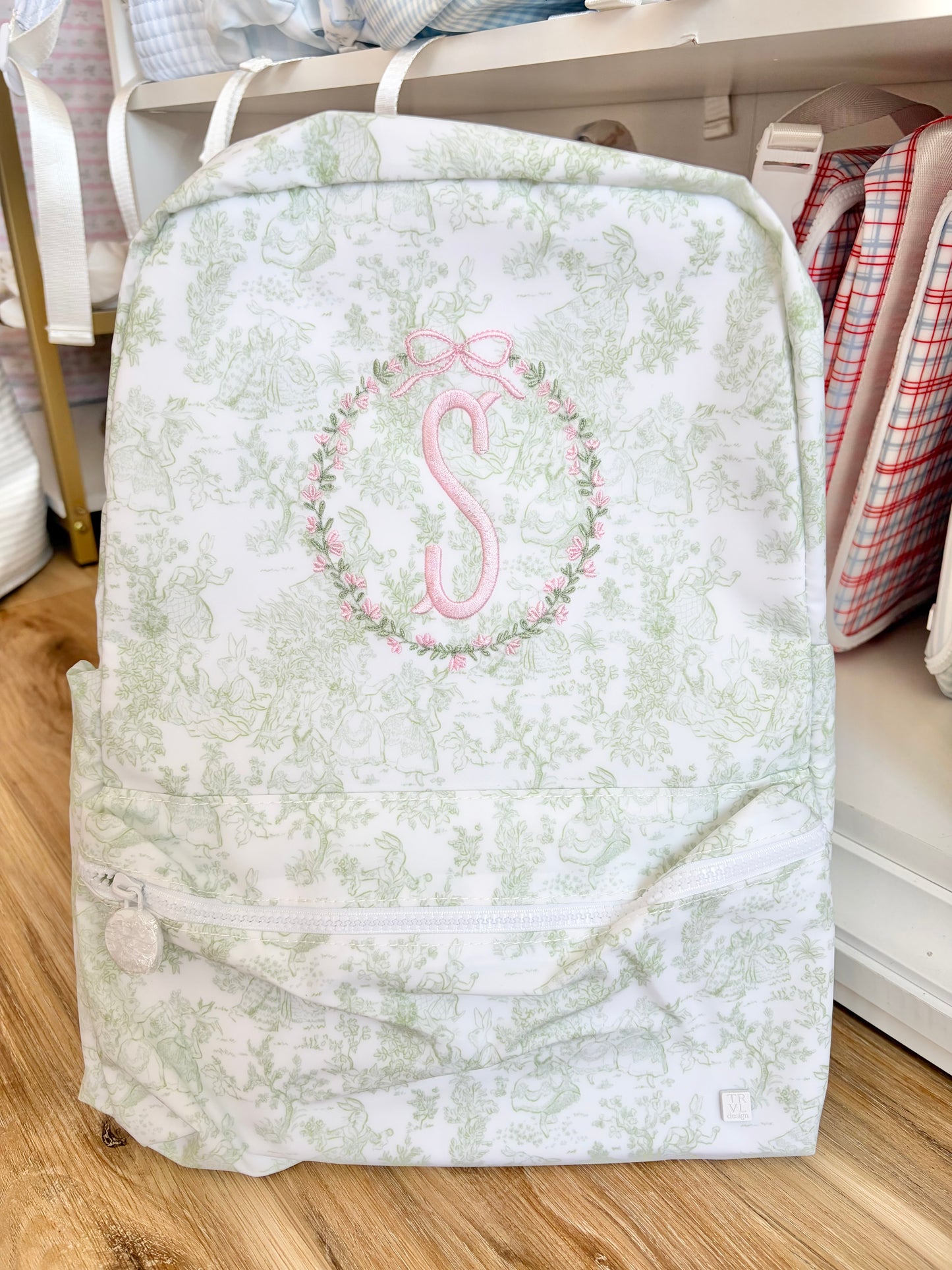 TRVL Sage Bunny Toile Backpack with Floral Crest Design