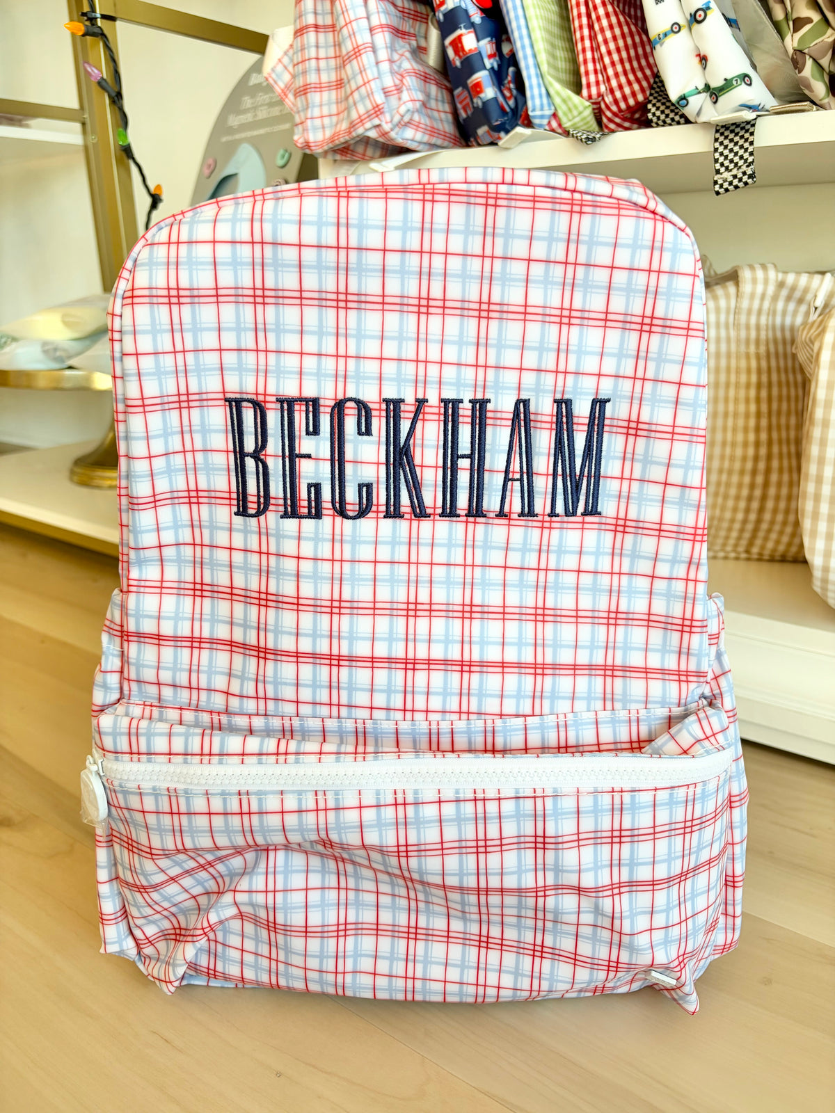 TRVL Classic Red Plaid Backpack with Navy Graved Font