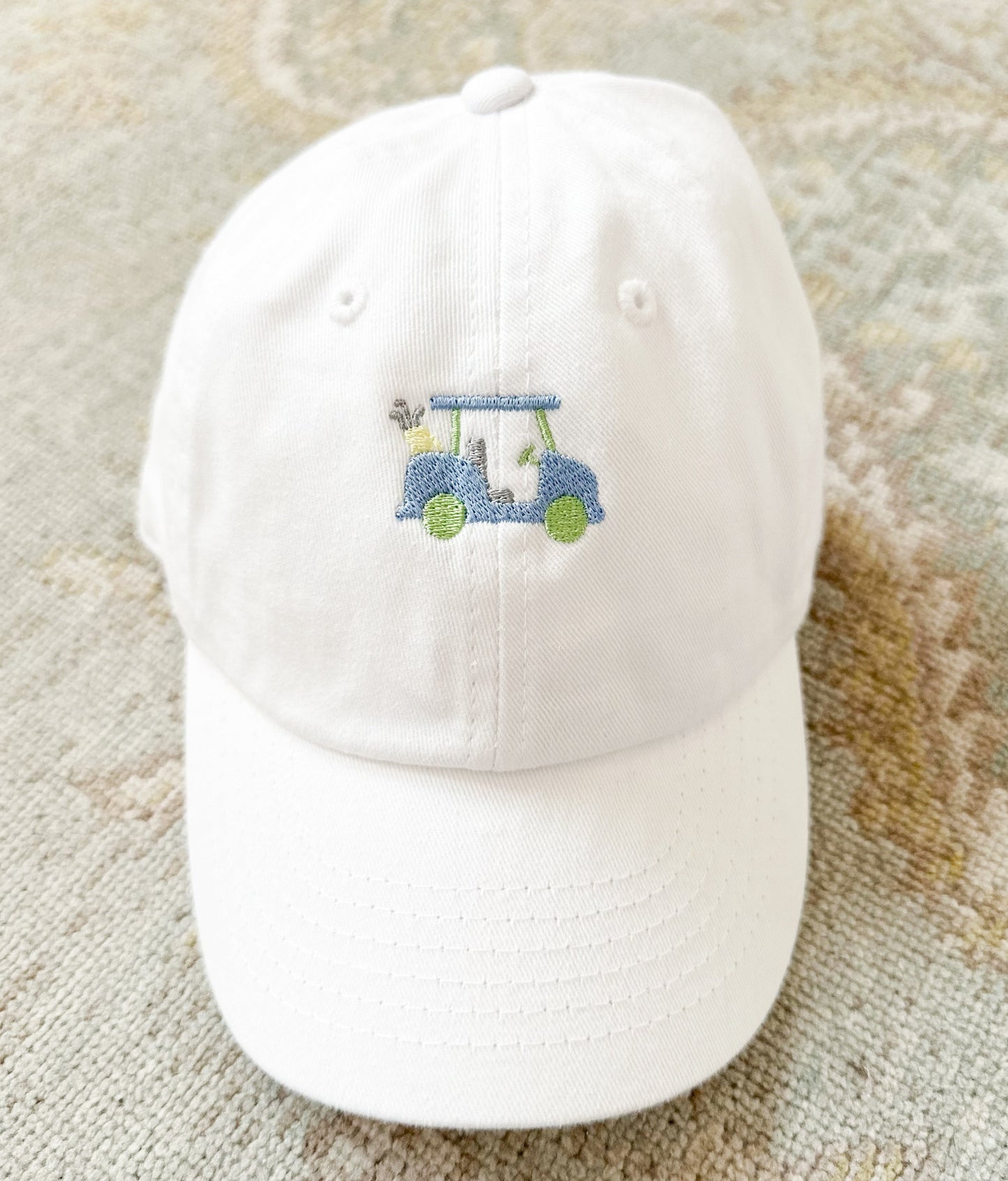 White Hat with Blue Golf Cart