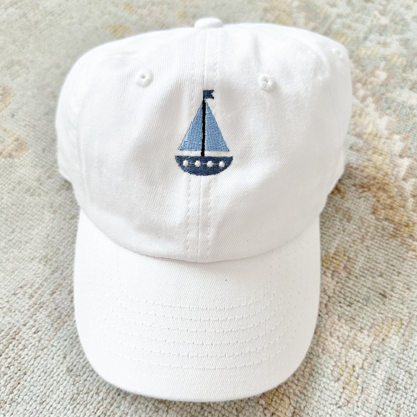 White Hat with Blue Sailboat